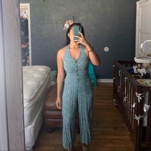 Halter bodysuit with flare boot cut legs.